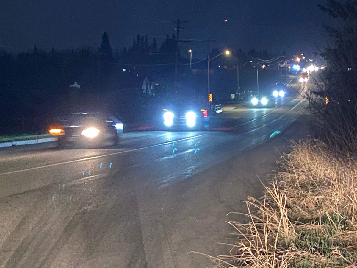 A convoy of vehicles on Highway 759 leaving Drayton Valley, Alta. just after midnight on Friday, May 5, 2023.