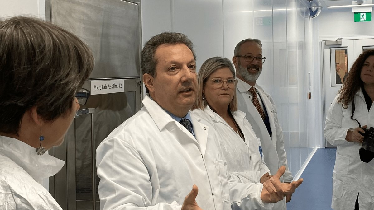 Fusion Pharmaceuticals Inc. chief technology officer Eric Burak and CEO John Valliant with Hamilton mayor Andrea Horwath at the ribbon cutting for a 27,000 square foot manufacturing facility set to produce targeted radiation therapies.