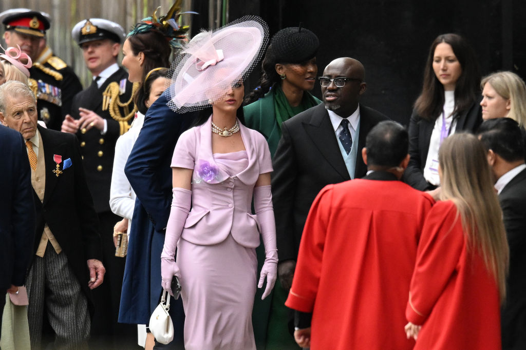 Katy Perry and Edward Enninful arrive at Westminster Abbey ahead of the Coronation of King Charles III and Queen Camilla on May 06, 2023 in London, England.
