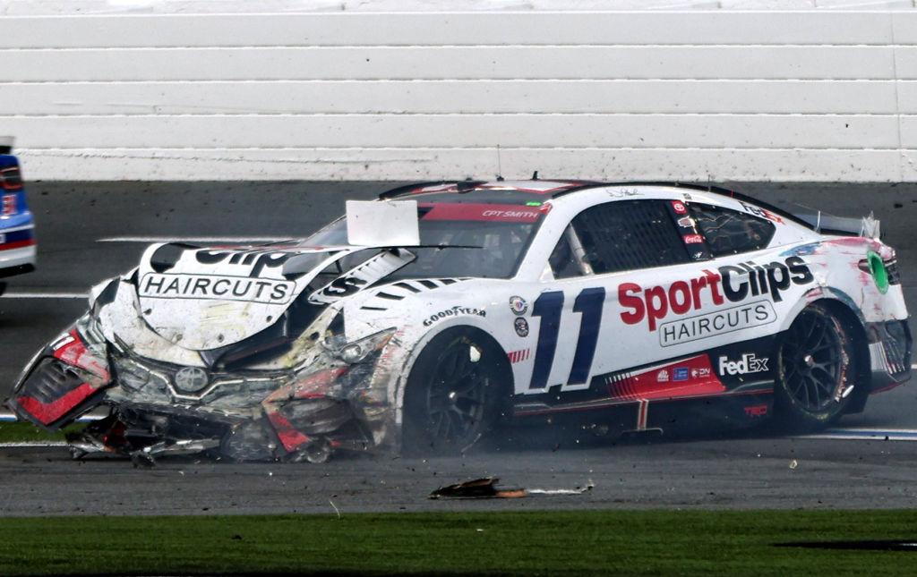 Denny Hamlin, driver of the #11 Sport Clips Haircuts Toyota, spins after an on-track incident during the NASCAR Cup Series Coca-Cola 600 at Charlotte Motor Speedway on May 29, 2023 in Concord, N.C.