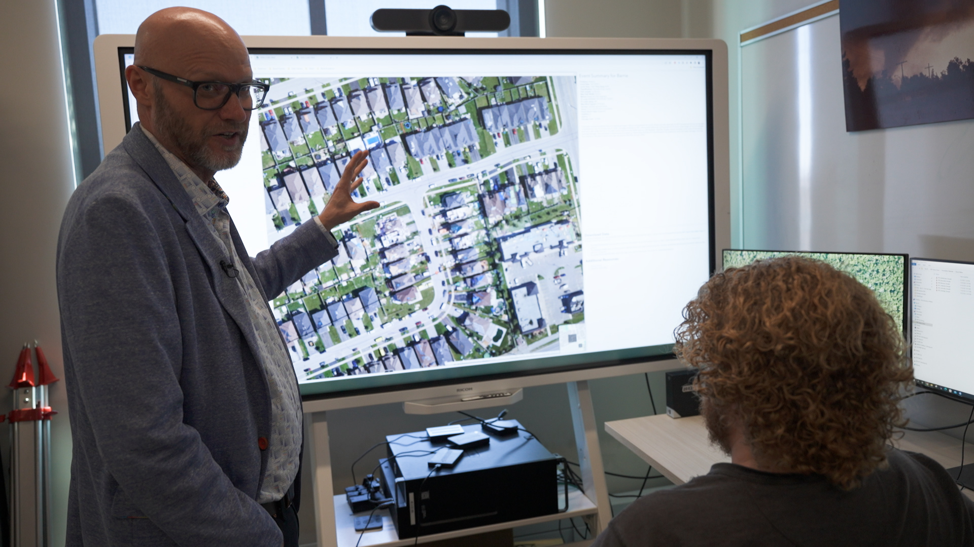 (L to R) Gregory Kopp and Connell Shamus Miller review the destruction caused by a tornado that hit a Barrie neighbourhood in 2021.