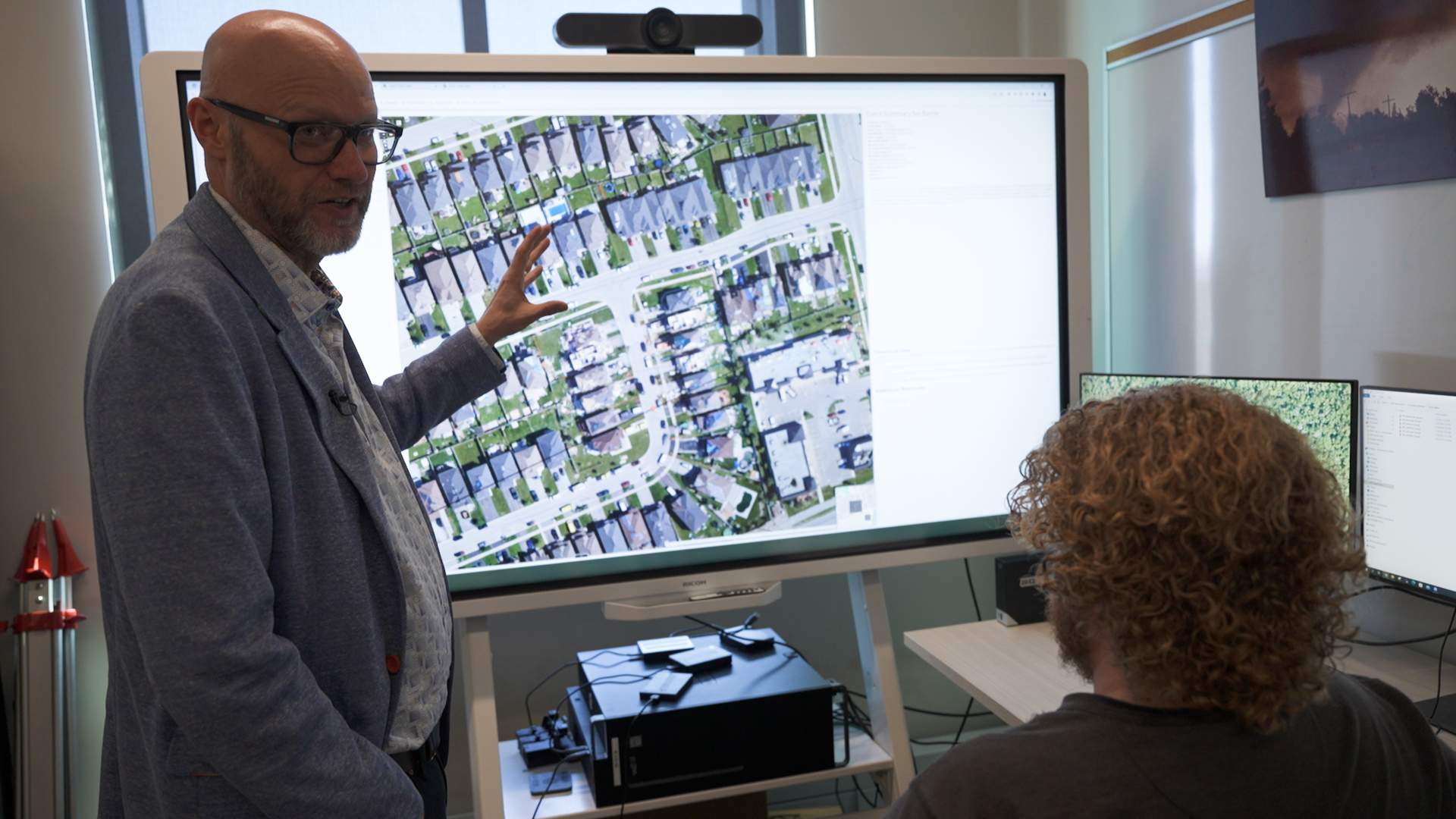 (L to R) Gregory Kopp and Connell Shamus Miller review the destruction caused by a tornado that hit a Barrie neighbourhood in 2021.