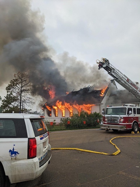 Two men were charged after a suspected arson attack on a church in Grouard, Alta., a hamlet near High Prairie.