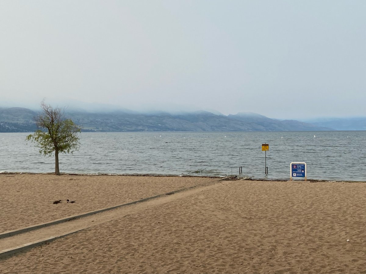 A view of the smoky skies in the Okanagan from a beach in Kelowna, B.C., on Wednesday morning, May 17, 2023.