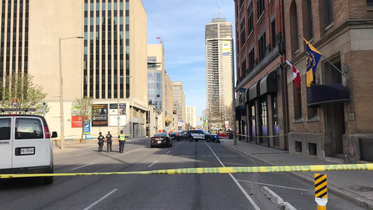 Police on location at Main Street East and James Street South in Hamilton following a crash April 14, 2023 that sent a bystander to hospital.