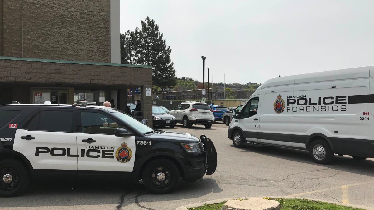 Police on scene investigating an afternoon shooting incident at 21 Sanford Street May 9, 2023 in central Hamilton, Ont.