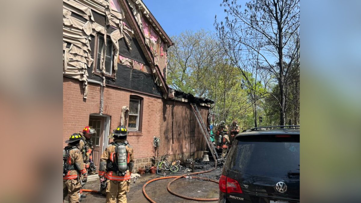 Fire crews battled a multiple-alarm blaze in a residential neighbourhood at Cloverhill Road in Hamilton, Ont. on May 15, 2023.