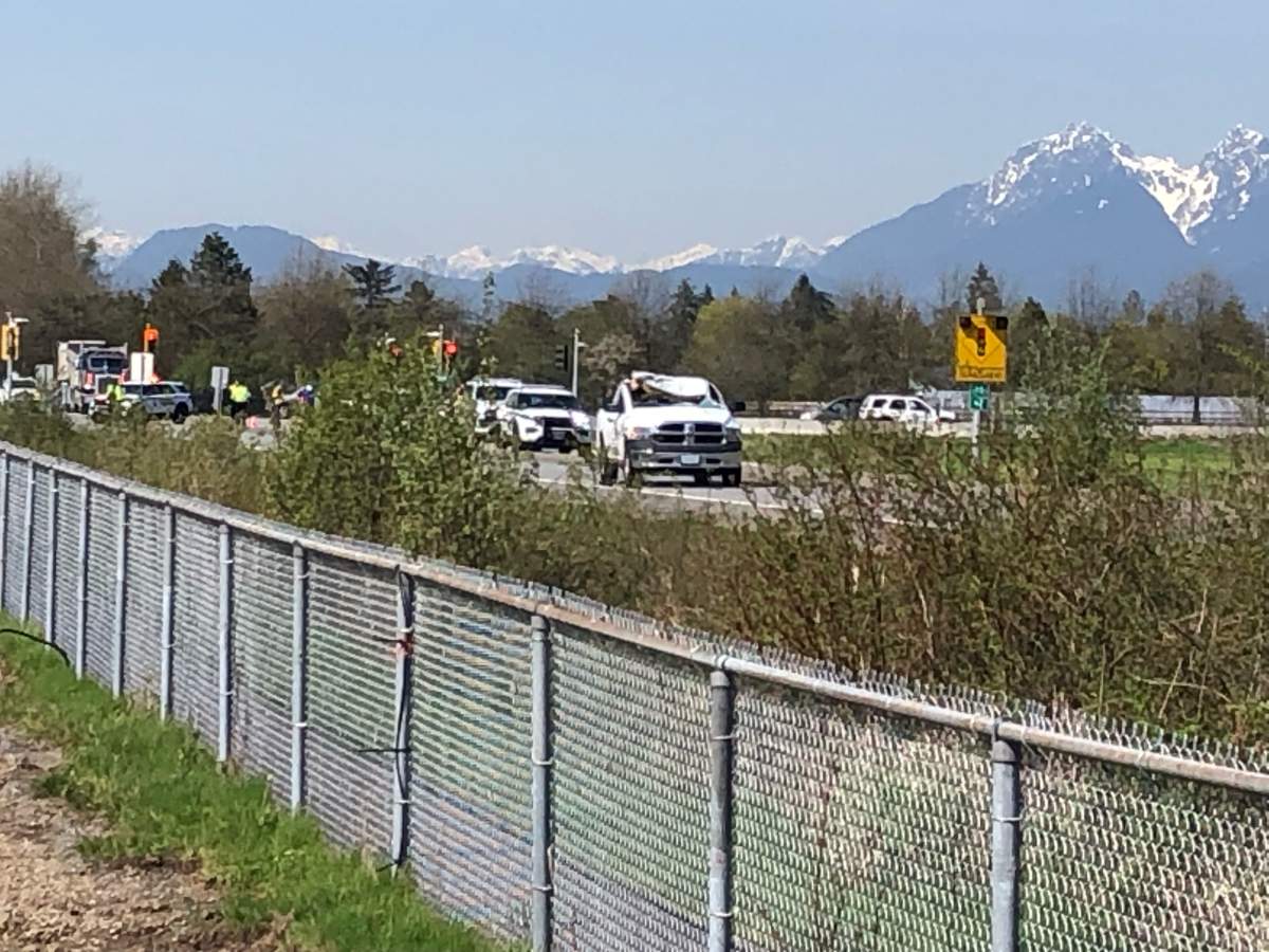 This photo shows the white truck with a crumpled roof outside the Langley Regional Airport.