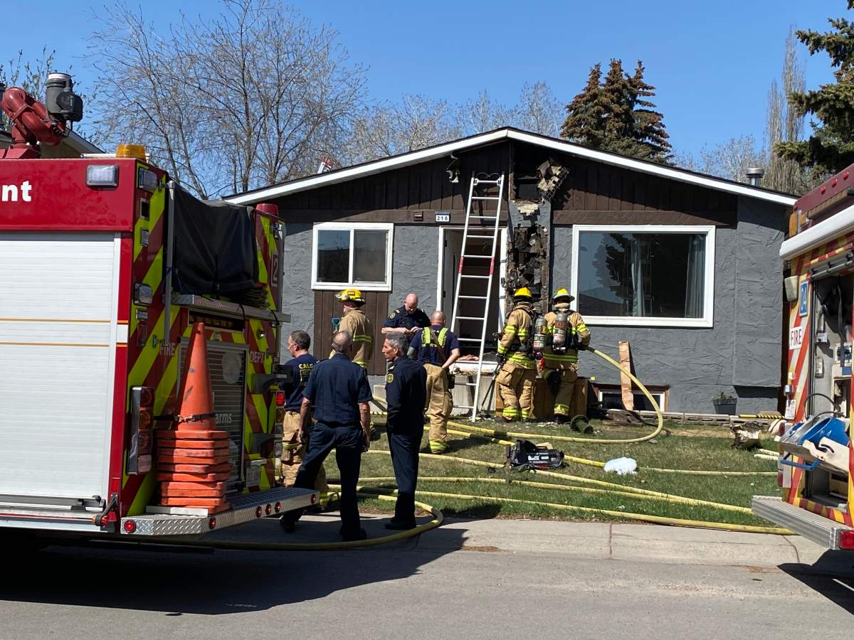 Calgary fire crews are shown after putting out a house fire on Rundlecairn Road, on May 3, 2023.