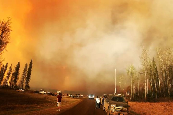 Thousands flee northern Alberta wildfire: ‘People are really scared’