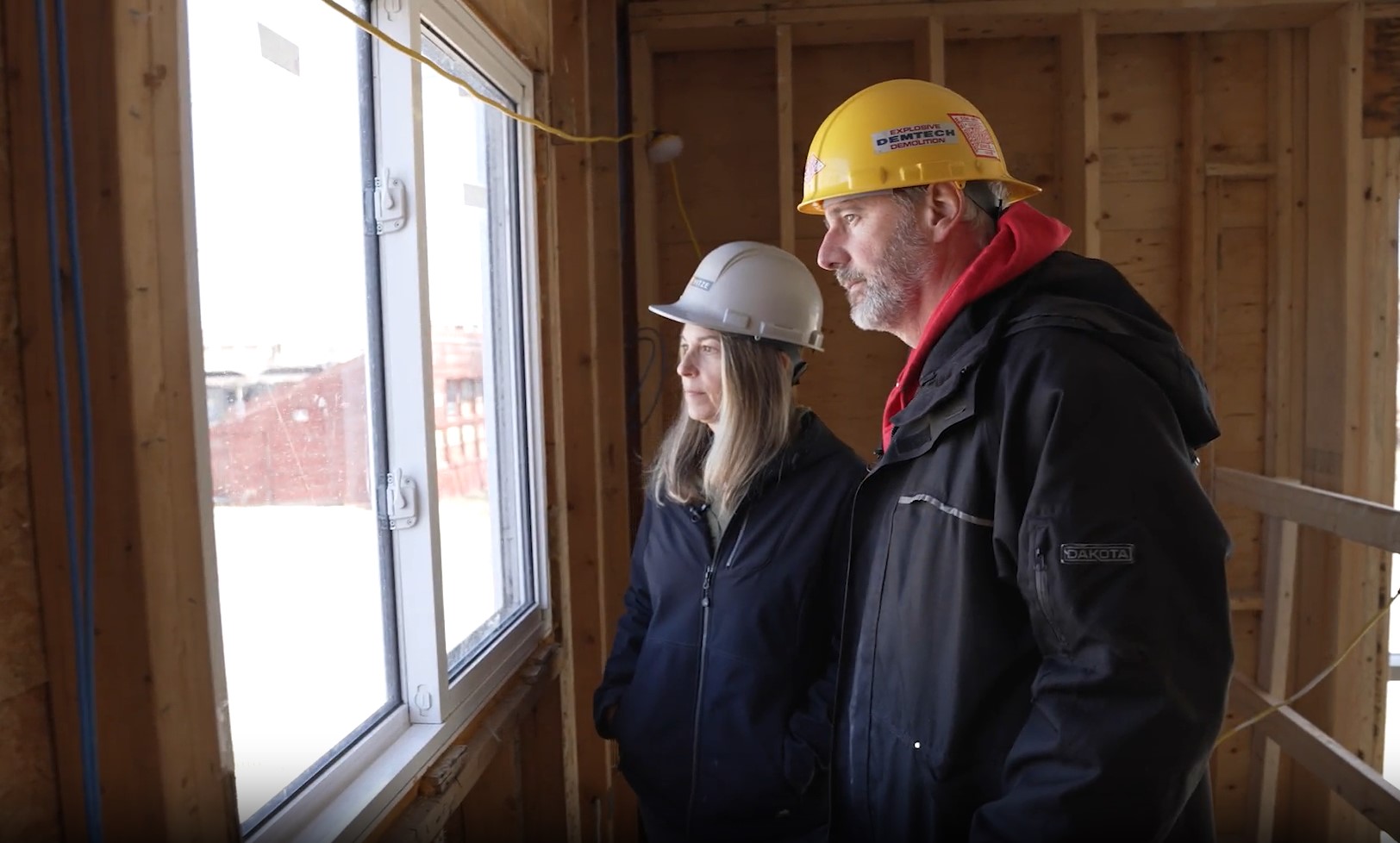 Joanne Richter and Rob Garrard, co-founders and owners of The Second Wedge Brewing Company, inspect the construction at their their business after it was destroyed by a tornado in 2022.