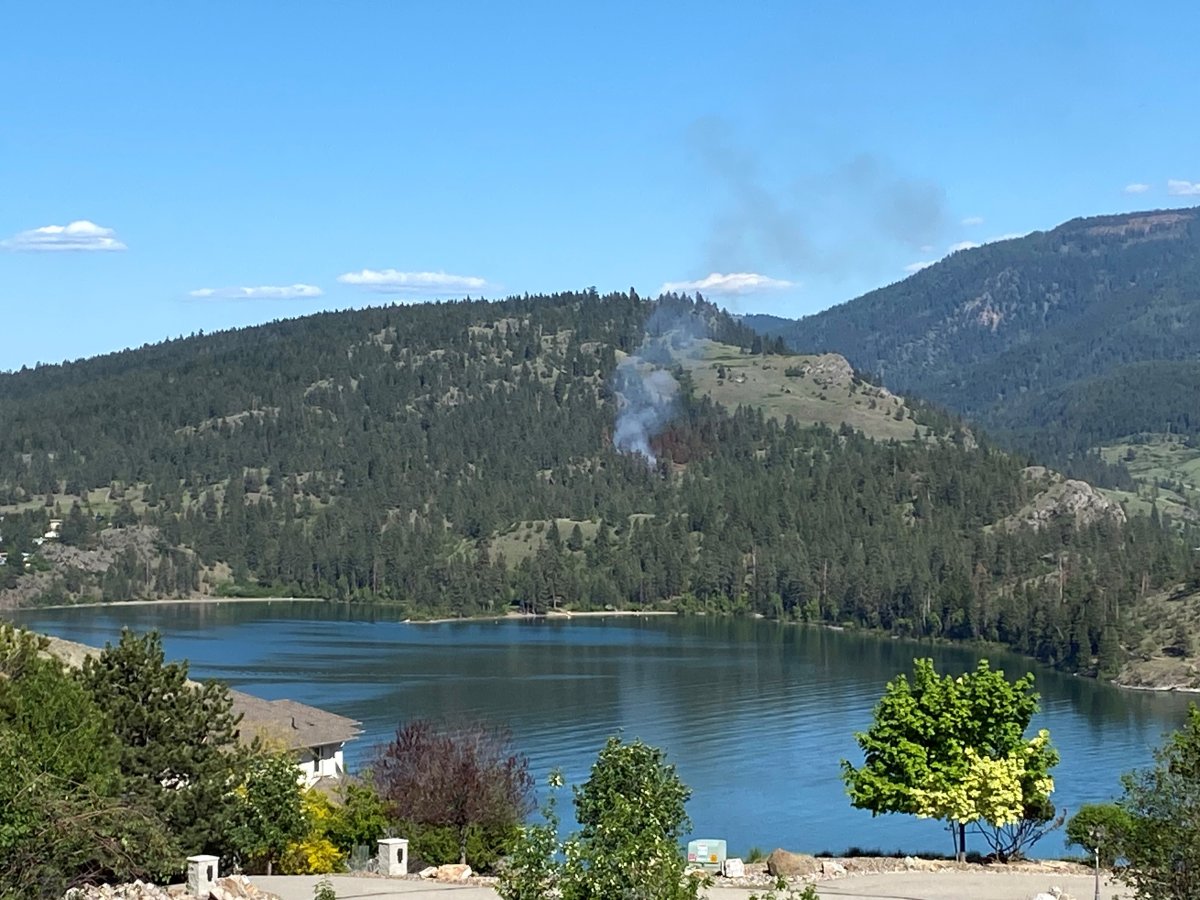 Smoke rises from a wildfire in Kalamalka Lake Provincial Park on Friday afternoon.