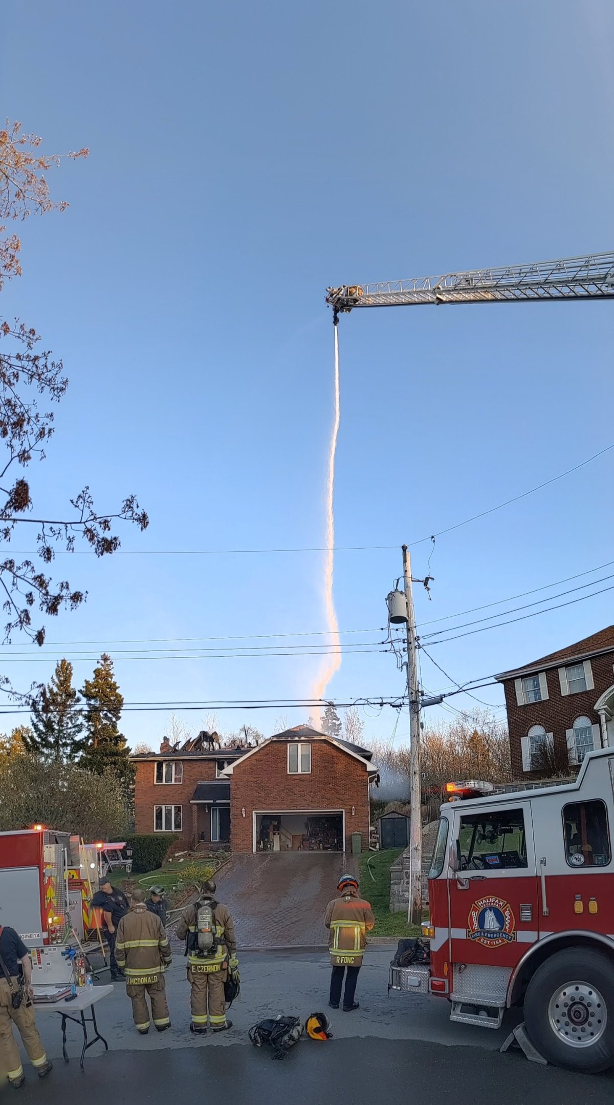 Firefighters pull out of Dartmouth house fire just before roof collapses