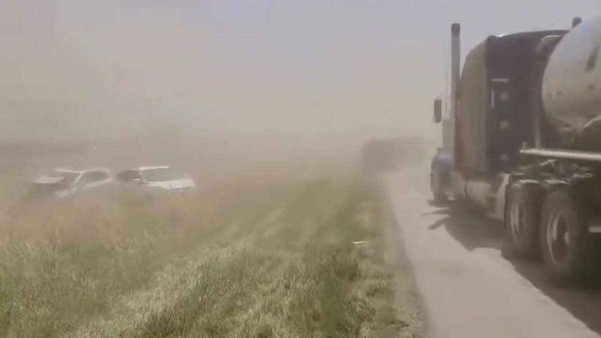 First responders attend the scene of a multi-car pileup on Interstate 55 in Montgomery County, Ill., on May 1, 2023, after high winds kicked up dangerous clouds of dust from nearby farm fields.