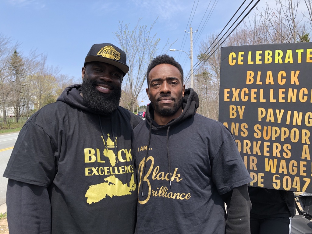 African Nova Scotian student support workers AJ Simmonds and Lem Sealey stand outside Cole Harbour High on Monday, May 15, 2023.