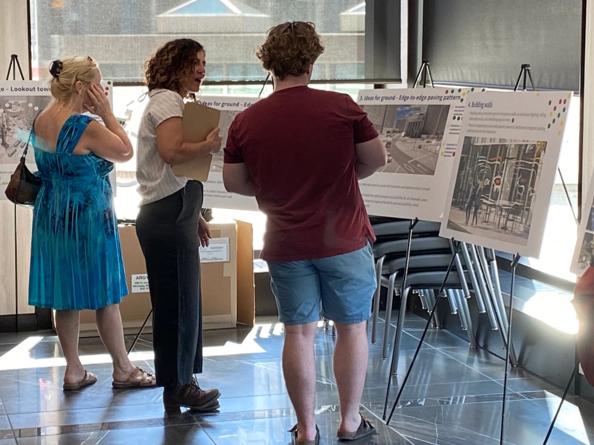 Winnipeggers look over proposals for the future of Portage  and Main at 201 Portage Avenue on Wednesday.