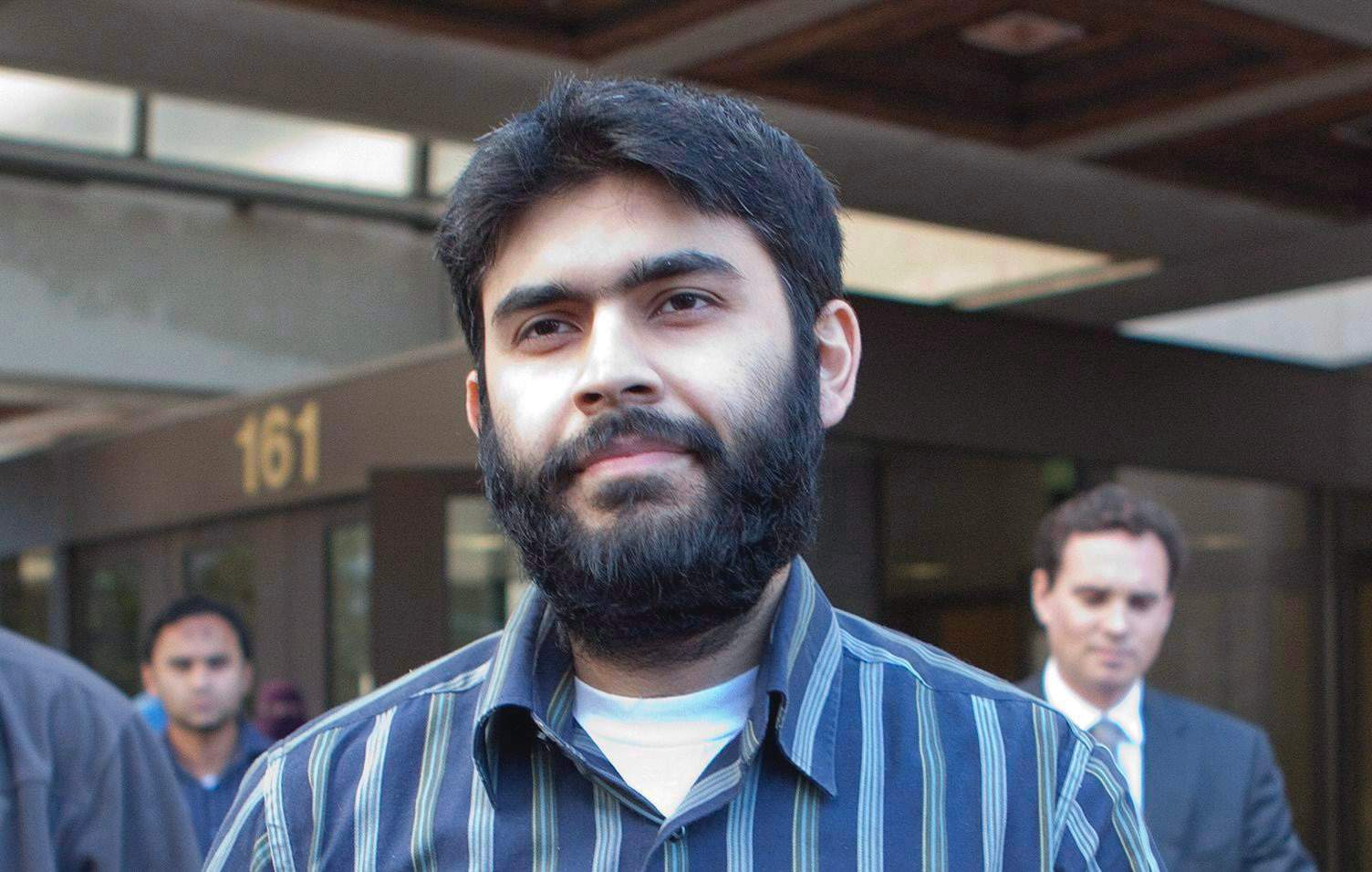 Misbahuddin Ahmed walks out of Ottawa Courthouse on bail, September 28, 2010. THE CANADIAN PRESS/Pawel Dwulit