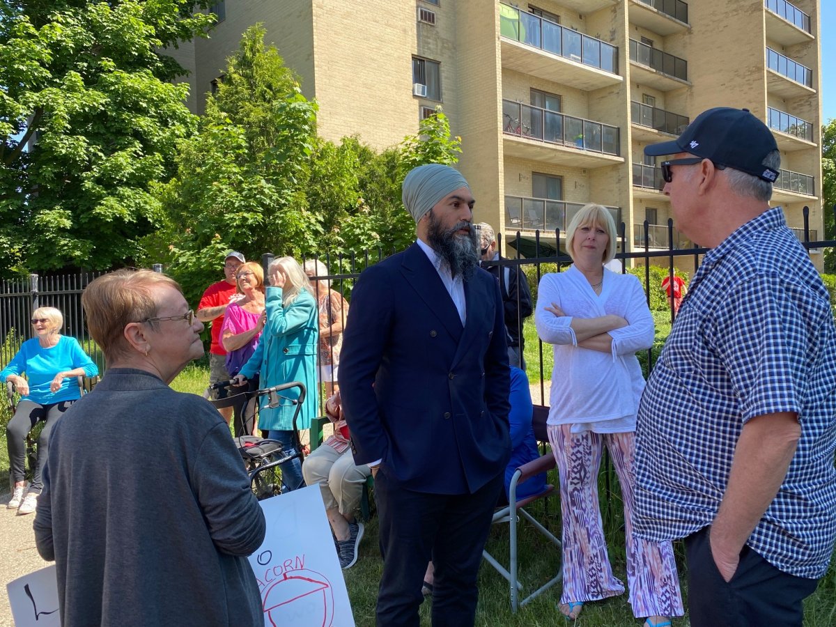 NDP Leader Jagmeet Singh speaks with tenants of two Webster Street apartments where residents say they are facing 'renovictions' on May 26, 2023.
