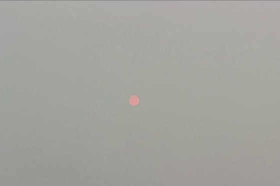 The sun is seen amid smoky conditions in Edmonton on May 16, 2023.