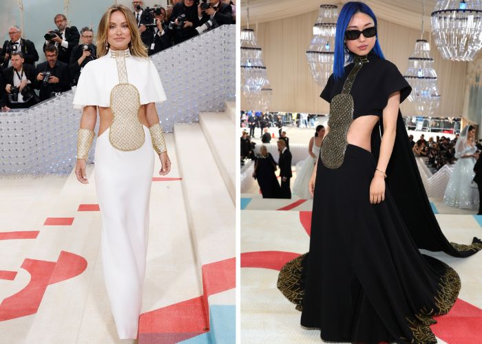 Olivia Wilde and Margaret Zhang wear the same dress, Wilde in white and Zhang in black. The dress is full-length with a gold motif in the middle and cut outs along the hips.