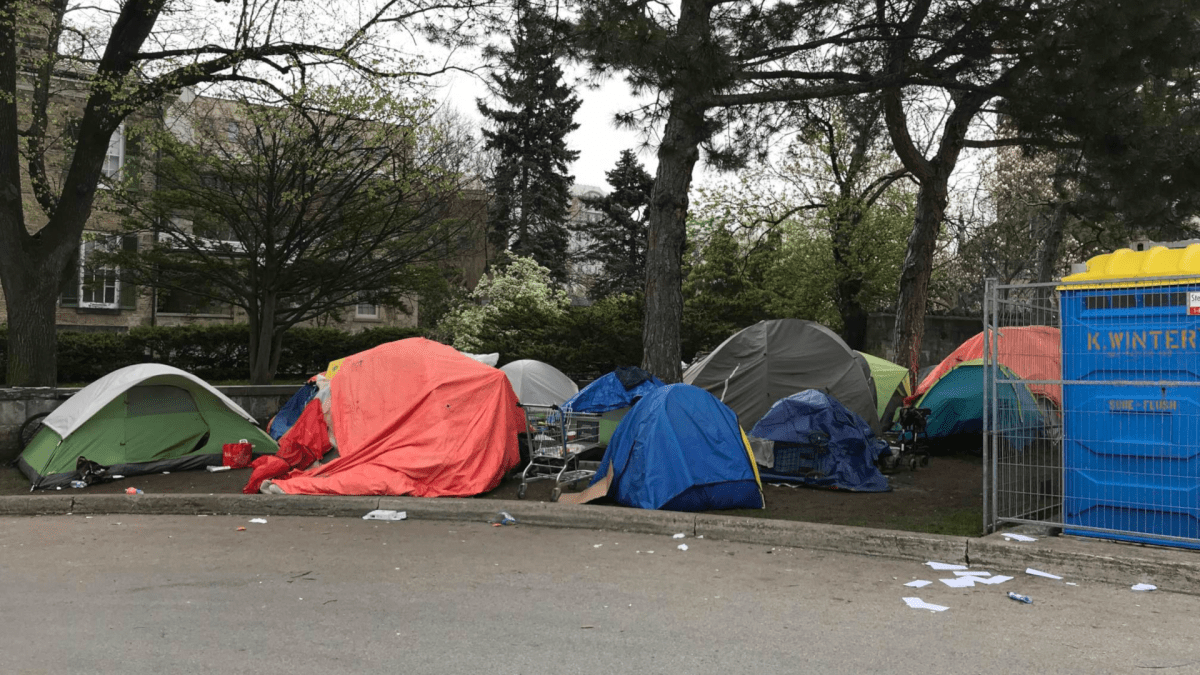 Municipal law enforcement told people living in tents behind Hamilton City Hall on May 4, 2023 they need to clear out 'effective immediately.'.