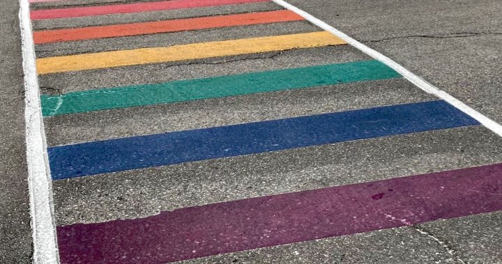 Cambridge rainbow crosswalk painted white on eve of day against homophobia, biphobia, transphobia