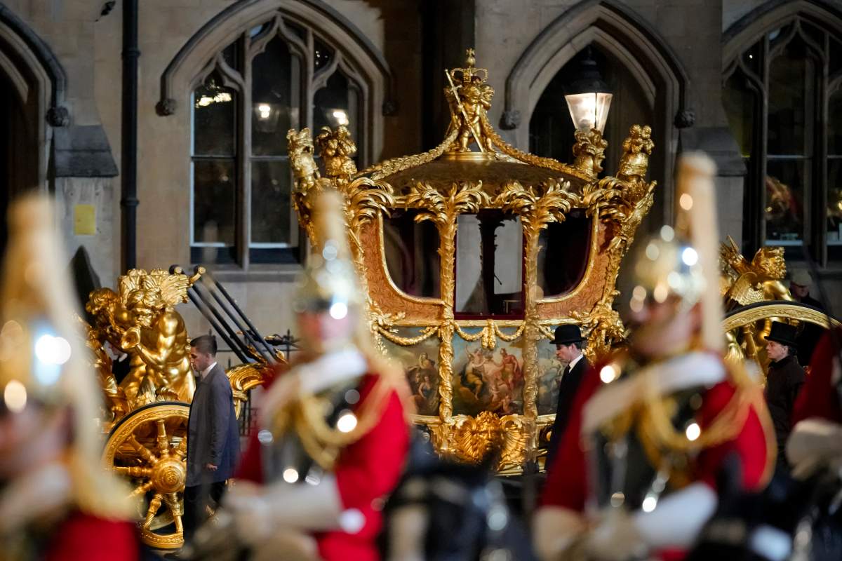 The Gold State Coach leaves Westminster Abbey.