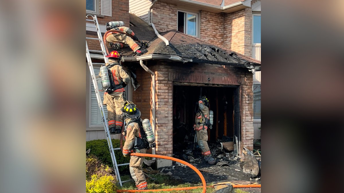 Firefighters battled a blaze at a Stoney Creek townhouse near Highway 8 on May 18, 2023.