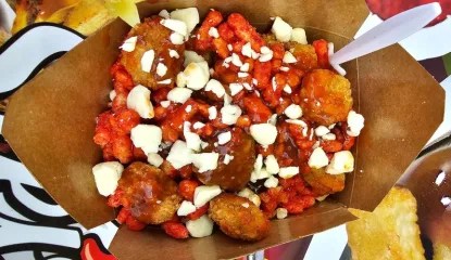 Flamin' Hot Cheetos and Nashville-style hot sauce are added to popcorn chicken poutine to give it a fiery kick.