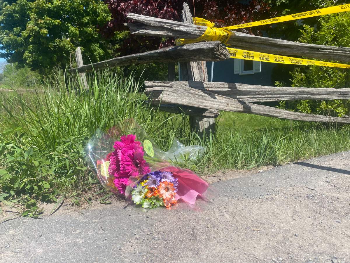 A bouquet of flowers rests near the daycare in Hamilton Township on May 26. OPP say a toddler reported missing on May 25 was found deceased on the property.