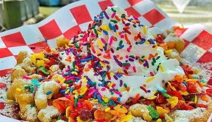 Think cereal milk on the midway. Crushed fruit loops, strawberries, condensed cereal milk and whipped cream.