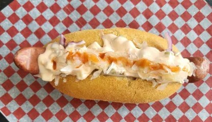 A 10-inch hot dog made with alligator trim and gouda cheese.