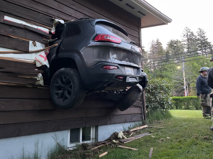 Vehicle takes flight and crashes into side of house near Halifax