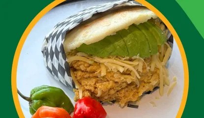 Arepa filled with shredded marinated chicken, cheese, avocado, topped with homemade habanero hot sauce.