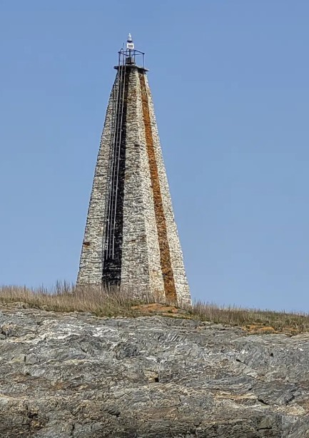Little Mark Island and Monument stands between Broad Sound and Casco Bay, May 11, 2023, off the coast off Harpswell, Maine.