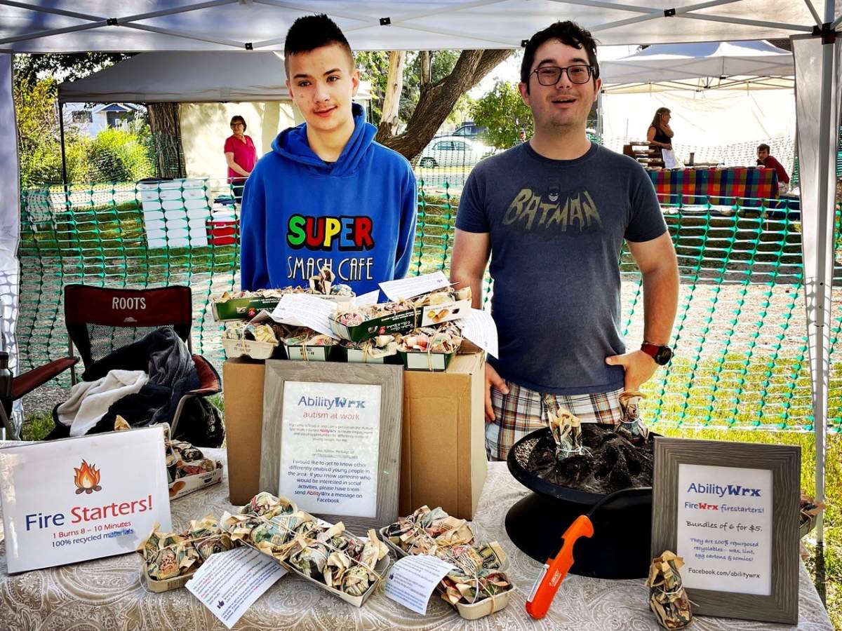 Entrepreneur Teague Johnson sells his products at market.