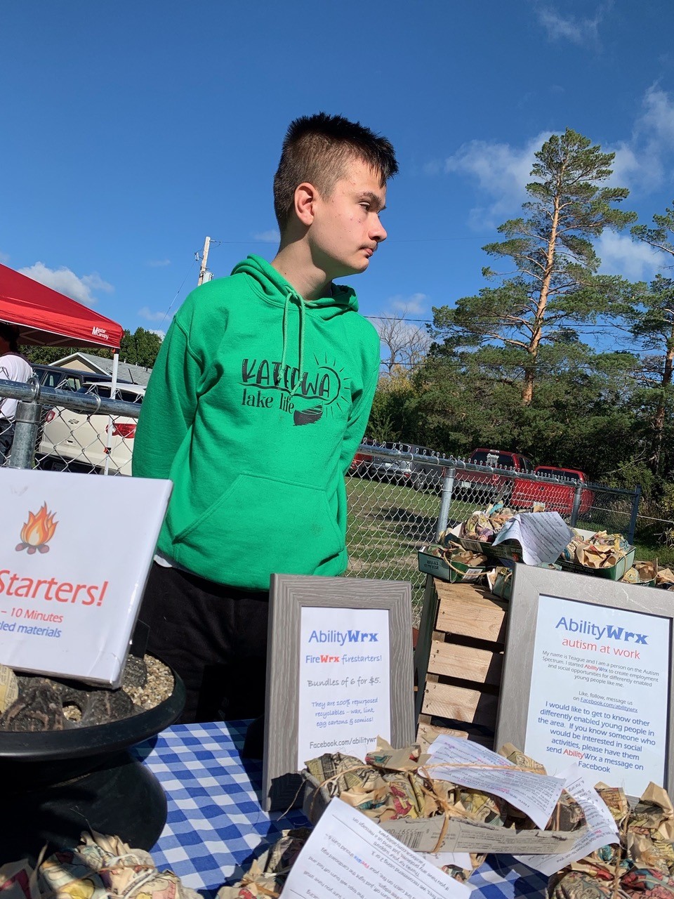 Teague selling his product at market