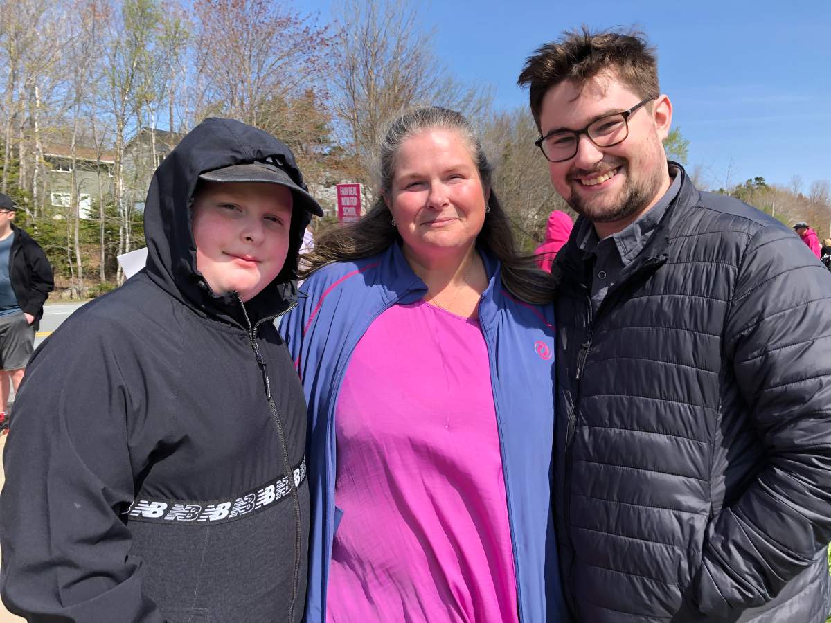 Educational Program Assistant Jeanine Mumford stands with her sons on the picket line outside Cole Harbour High School.