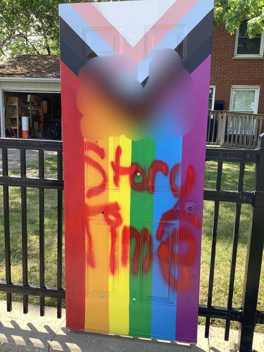 An image of a door vandalized at St. Aidan’s Anglican Church in London, Ont.,as seen on May 28, 2023. (blurred due to profanity).