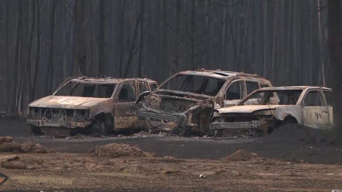 Burnt-out cars in East Prairie Métis Settlement in northern Alberta following a wildfire in early May 2023.