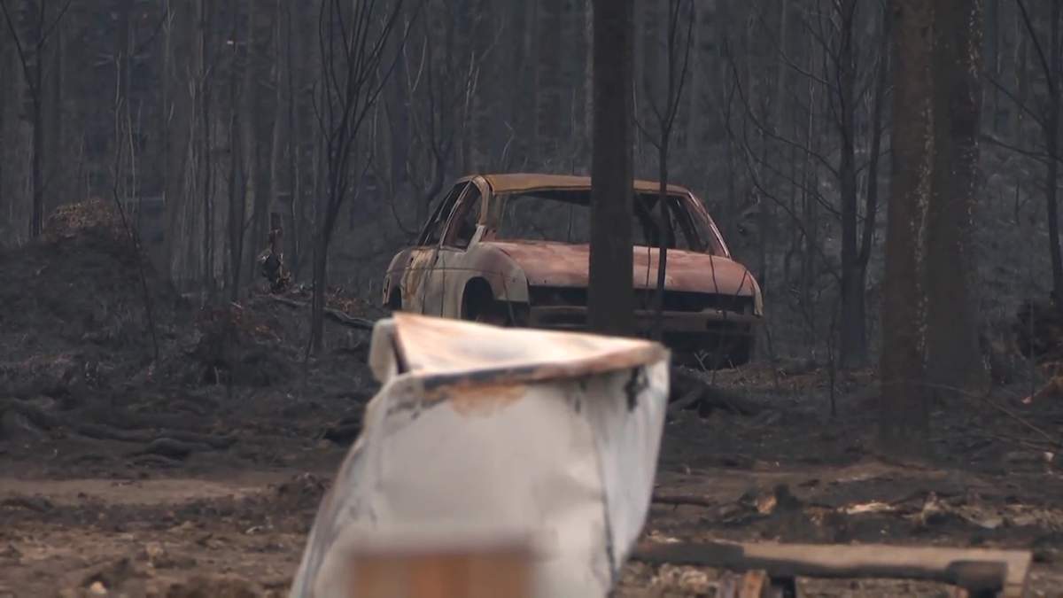 A burnt-out car in East Prairie Métis Settlement following a wildfire in early May 2023.