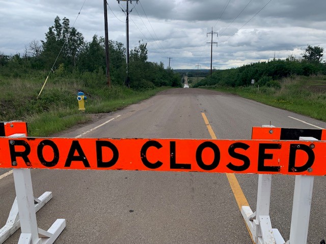 Edmonton road at 137 Avenue and 17 Street washed out by heavy rain on Monday, June 19, 2023.