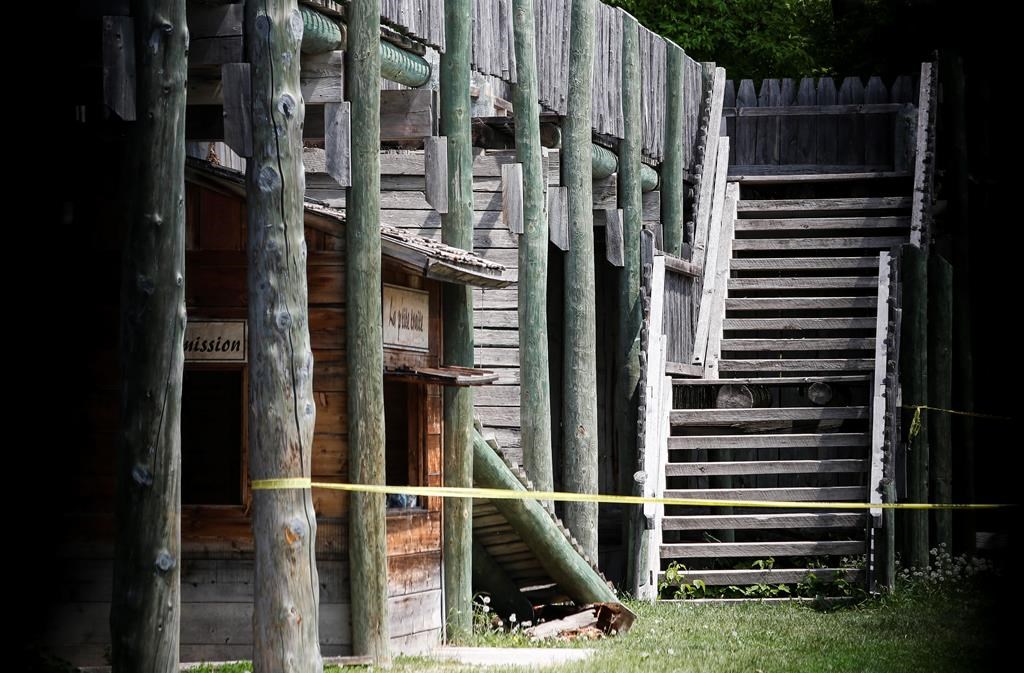 Two sections of a collapsed walkway are shown behind tape at Fort Gibraltar in Winnipeg, Wednesday, May 31, 2023.