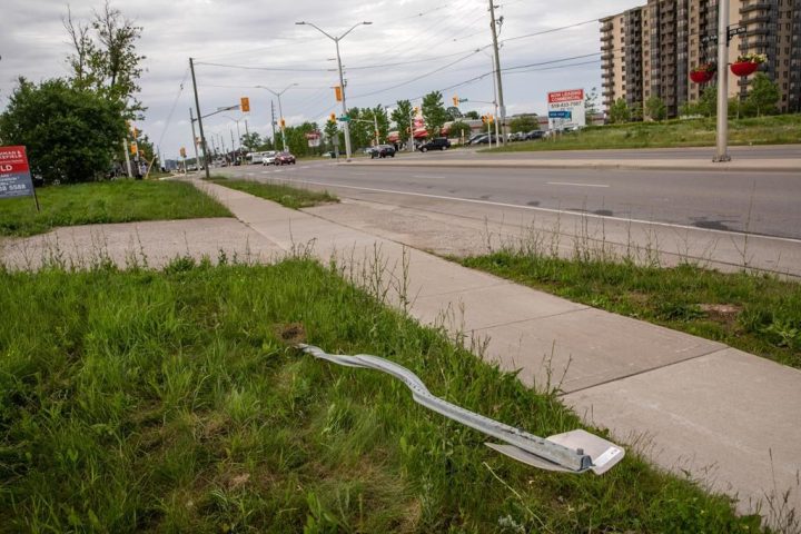 A destroyed street sign at the location where a family of five was hit by a driver, in London, Ont., Monday, June 7, 2021. Members of the Muslim community in London will host a vigil to mark the second anniversary of the worst mass killing in the city's history. 