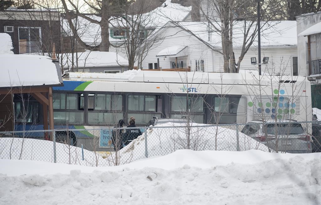 A city bus is shown next to a daycare centre in Laval, Que, Wednesday, Feb. 8, 2023. 