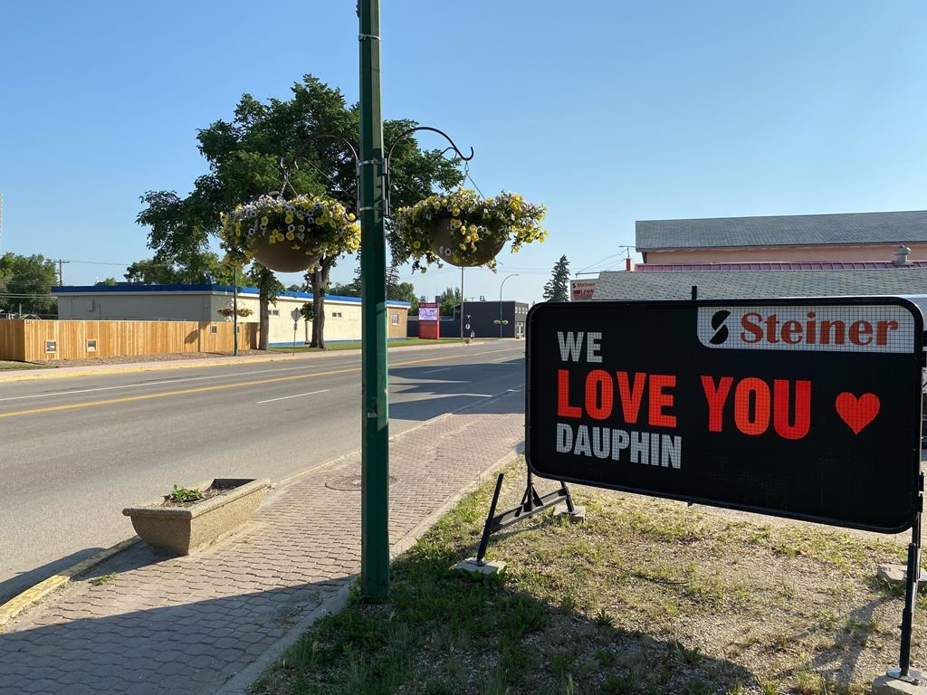 A sign is seen outside a business in Dauphin, Man., on Saturday June 17, 2023. The mood remains sombre in the city as area residents learn more details of a highway crash that killed 15 people and injured 10. THE CANADIAN PRESS/Steve Lambert.