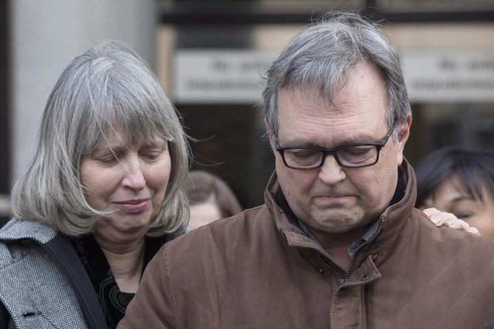 Clayton Babcock, right, stands next to his wife Linda as he reads a prepared statement outside court in Toronto on Saturday, Dec. 16, 2017. The Ontario families of victims of a multiple murderer want answers after the killer was moved to a medium-security prison. Mark Smich and Dellen Millard killed Toronto's Laura Babcock, 23 -- Millard's former flame -- in July 2012. The pair then went on to kill a stranger, Hamilton's Tim Bosma, 32, after taking him and his truck for a test drive 10 months later in May 2013.