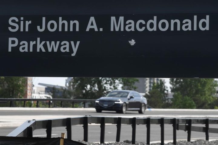 A vehicle travels along the Sir John A. Macdonald Parkway in Ottawa Wednesday June 2, 2021 in Ottawa. The National Capital Commission board of directors voted today to rename the Sir John A. Macdonald Parkway in Ottawa to the Kichi Zībī Mīkan, which translates to "Great River Road." .