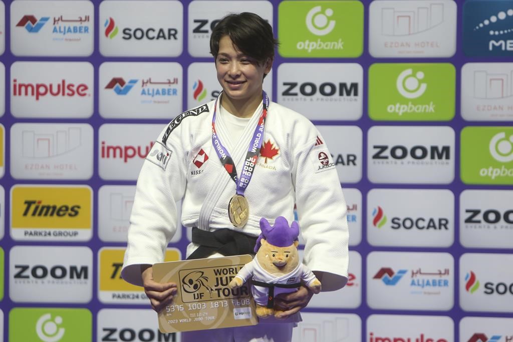 Gold medalist Christa Deguchi of Canada poses during the medal ceremony for women's -57kg competition at the World Judo Championships in Doha, Qatar, Tuesday, May 9, 2023. Deguchi clamied the women's under-57 kilogram gold medal at the Ulaanbaatar Grand Slam judo tournament Friday with a win over fellow Canadian Jessica Klimkait.