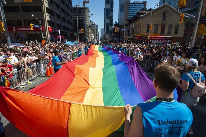 Large crowds pack Toronto streets as Canada’s largest Pride parade begins